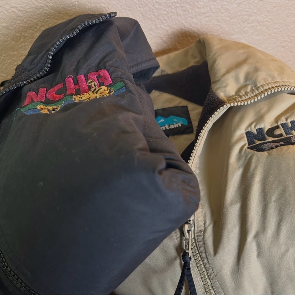 2 Tri-Mountain Med Size Vests. Tan & Black. National Cutting Horse Assoc. Logo